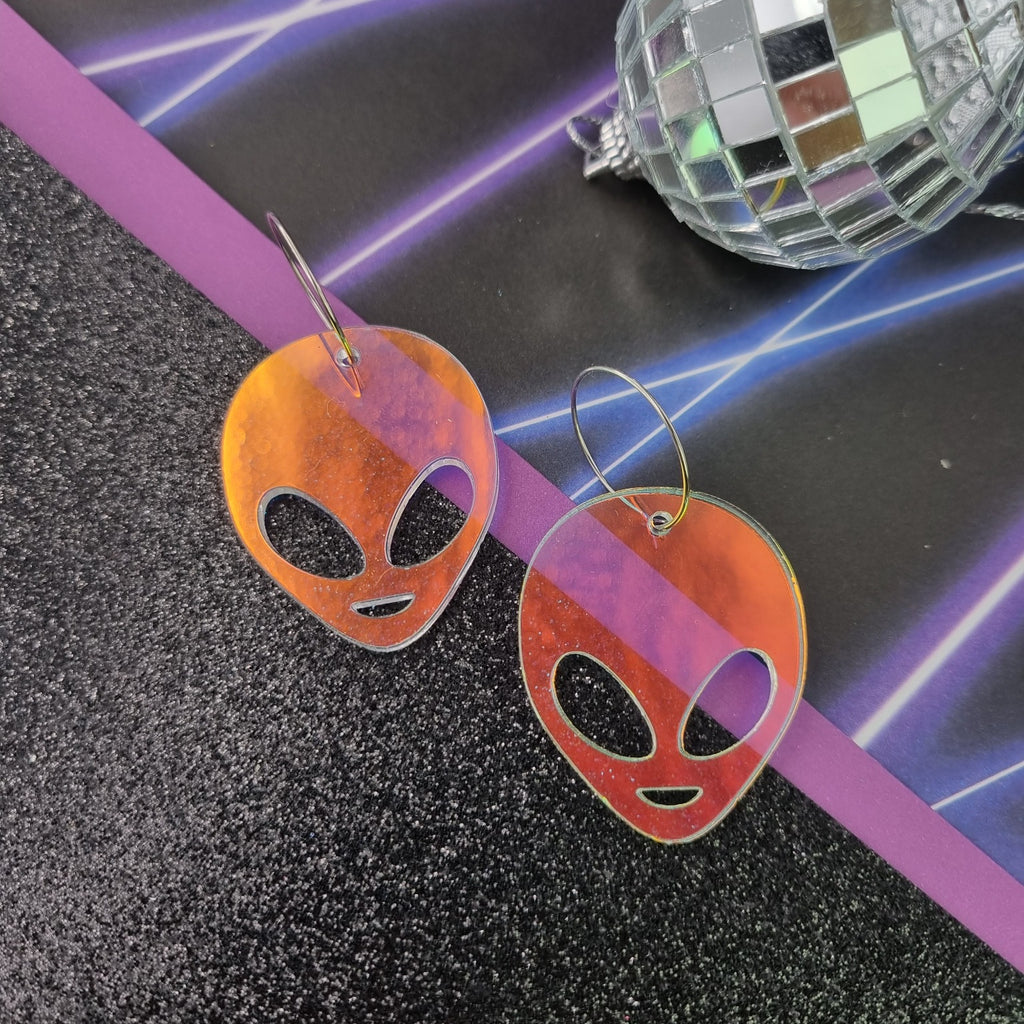 Alien head earrings with cut-out eyes on fine hoops