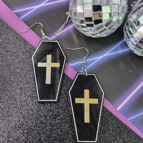 Black coffin drop earrings with white outline and gold cross, view 2