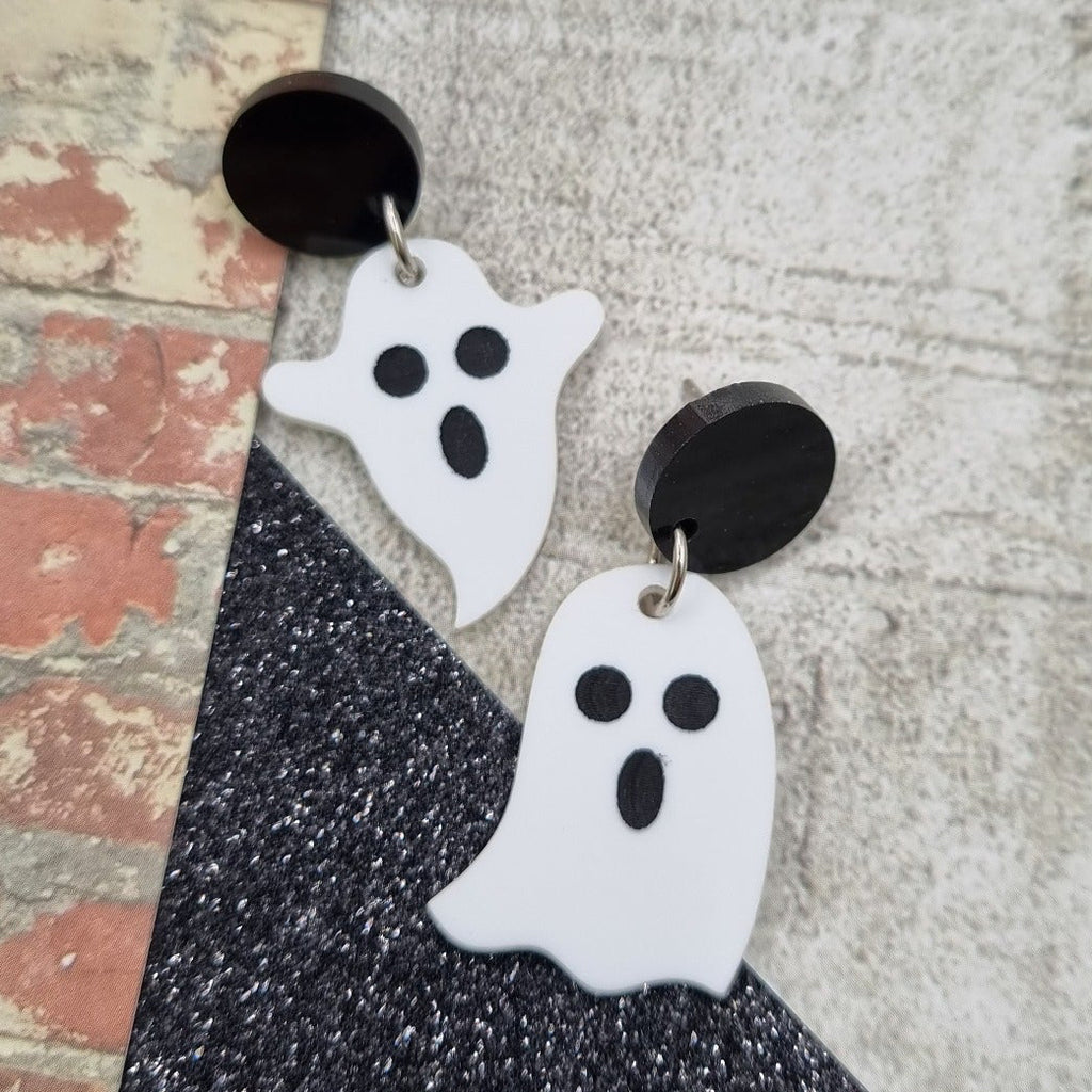 Little ghost drop earrings on round black studs, view 2