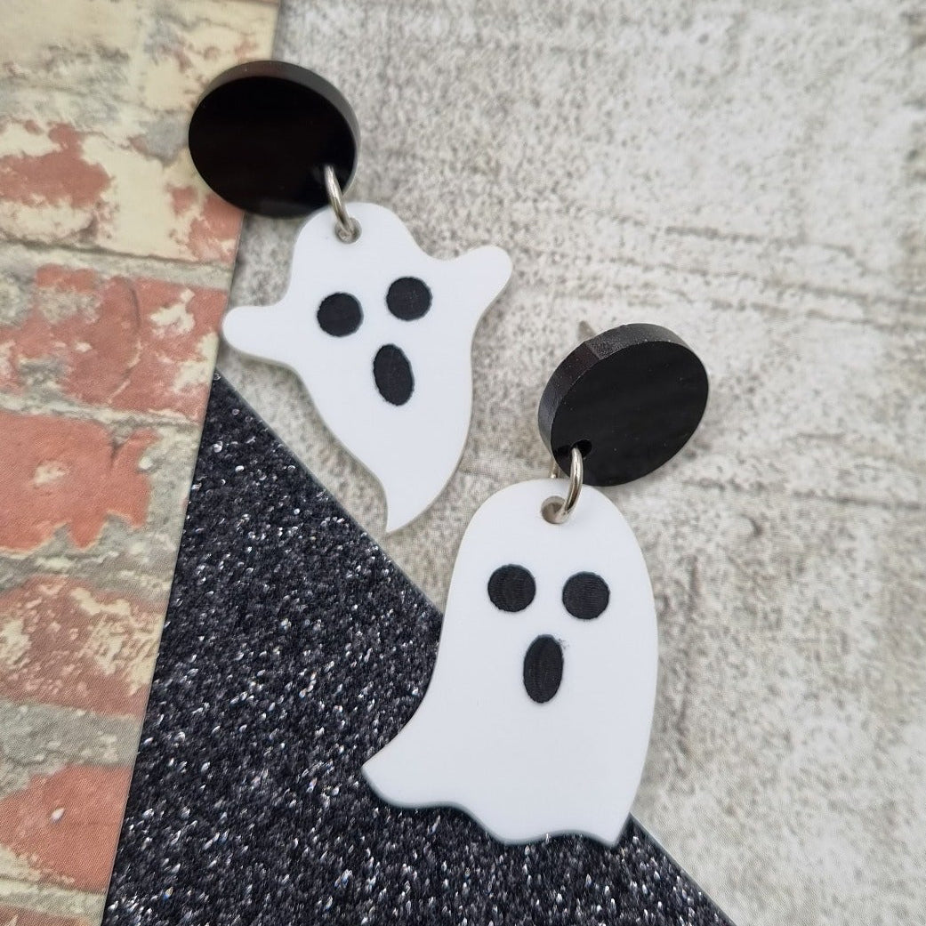 Little ghost drop earrings on round black studs, view 2
