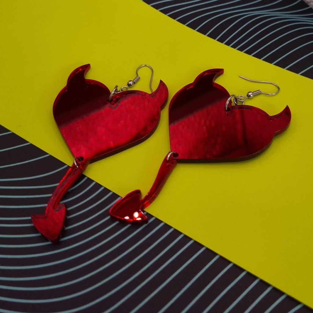 Red mirror heart earrings with devil horns and pointed tail