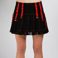 Black Tripp NYC pleated mini skirt with red stitching, red eyelet straps and lace hem