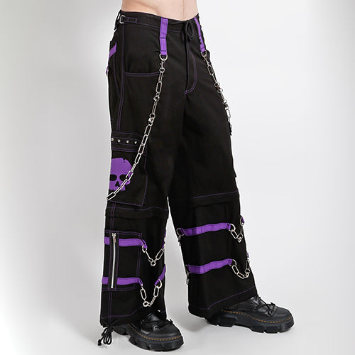 Black Tripp NYC zip-off pants with purple straps, purple skull print and chains