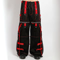 Black and red Tripp NYC X-strap zip-off pants