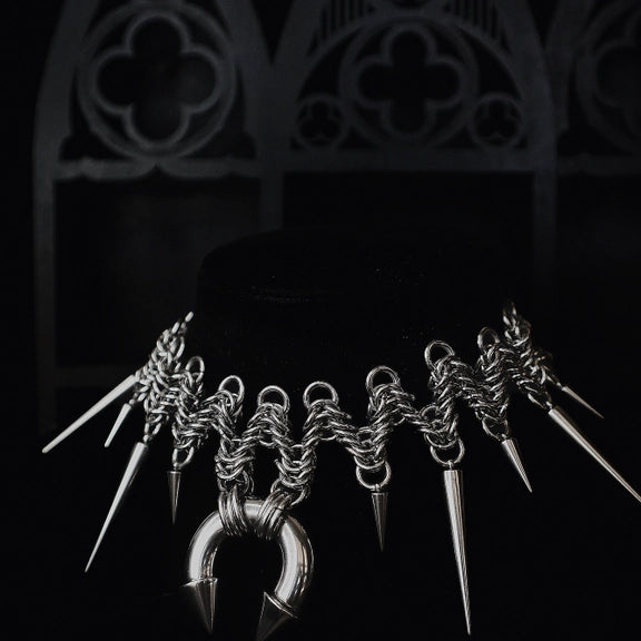 Aleister Choker, spiked chainmaille choker with horseshoe ring on a black bust
