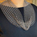 Kaiko chain maille necklace scarf worn draped over a black top
