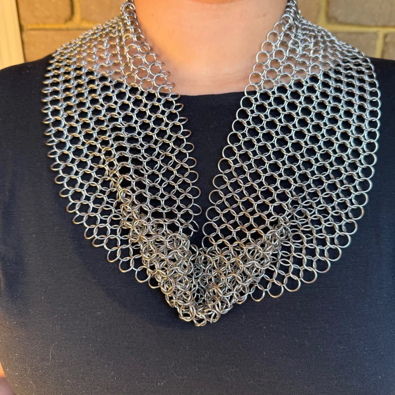 Chain maille necklace scarf resting across the collarbone and sternum