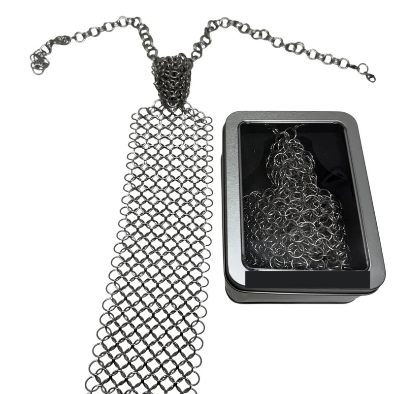 Chain maille tie with adjustable chain beside its window tin