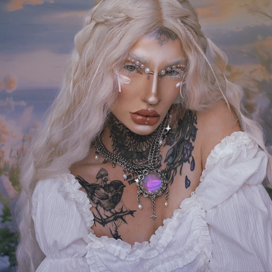 Liora Necklace, layered chainmaille necklace with violet cabochon worn on model