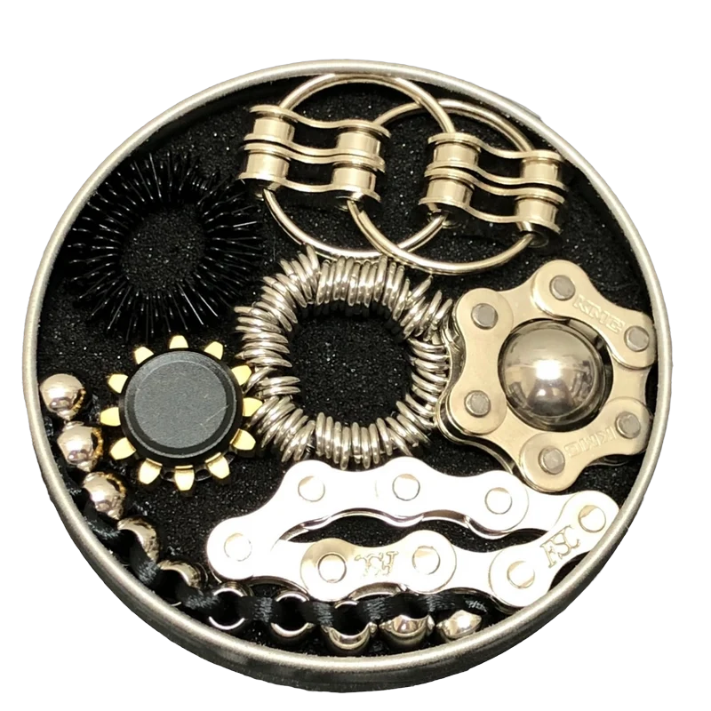 The Works Fidget Kit laid out in its foam fitted round tin