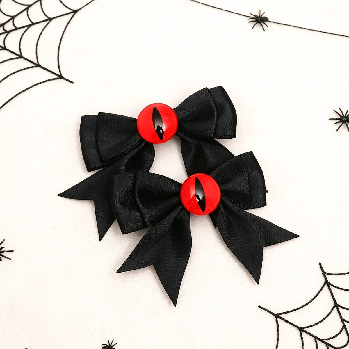 Hex Eye Bow Hair Clips, black satin bows with red demon eye