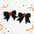 Hex Eye Bow Hair Clips, black satin bows with red demon eye