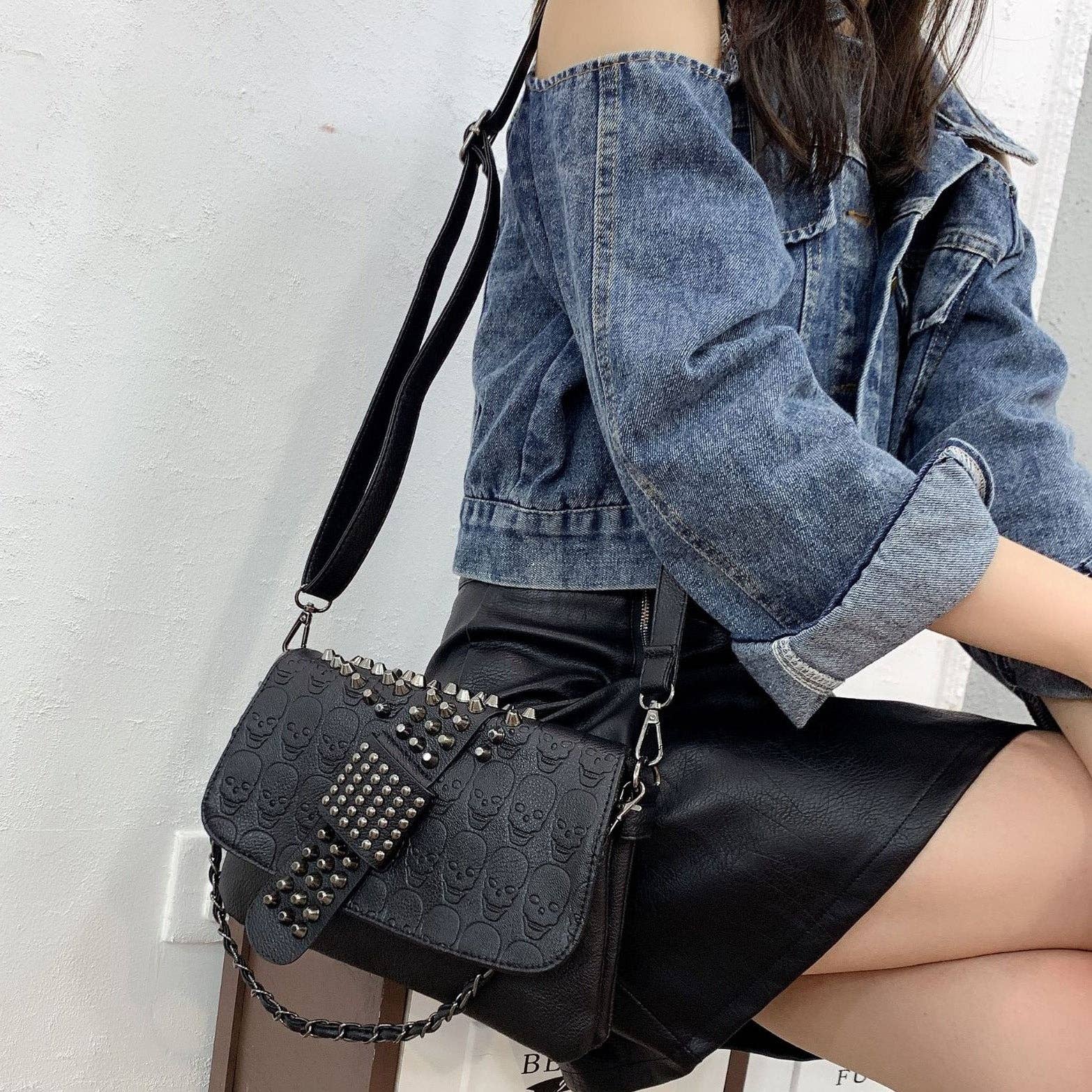 Riveted Embossed Skull Shoulder Bag: Pure Black