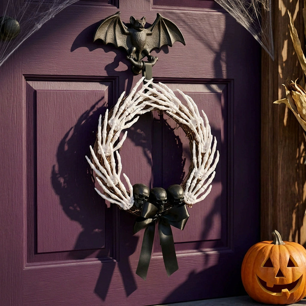 Grasping Hands Skull Wreath, grapevine wreath covered in skeleton hands with black skulls and bow