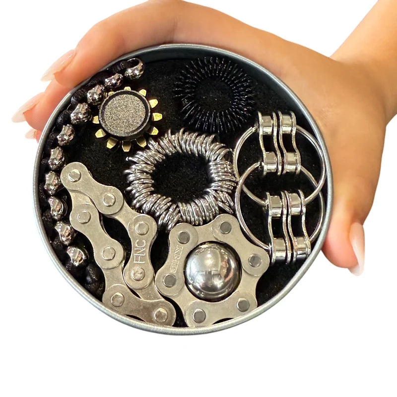 The Works Fidget Kit tin in black held in a hand